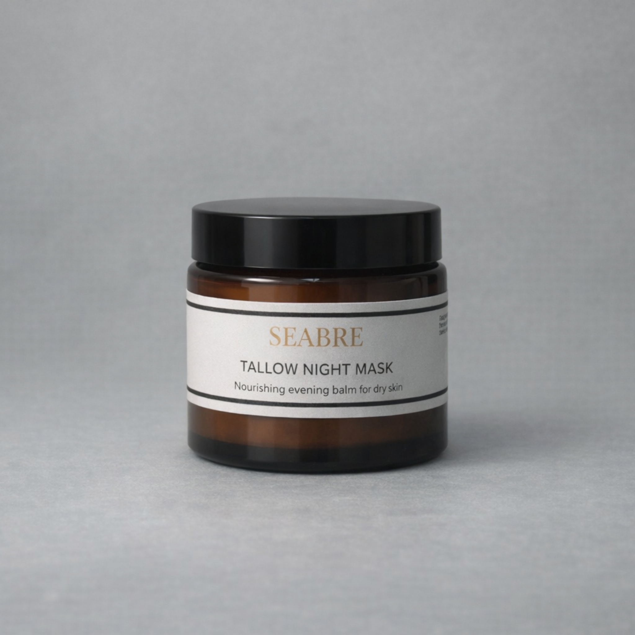 Seabre Tallow Night Mask jar on a gray background